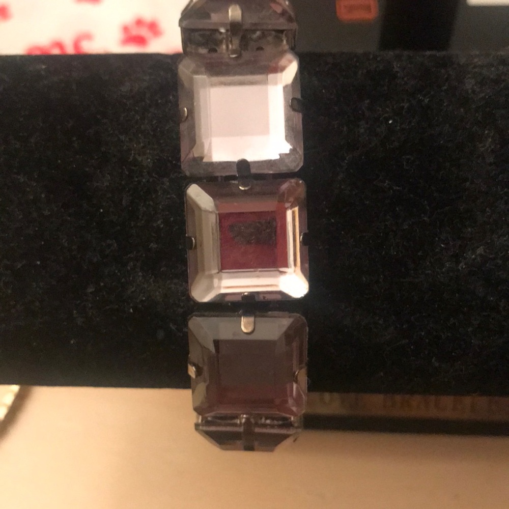 Purple crystal bracelet , slightly worn . Elastic band